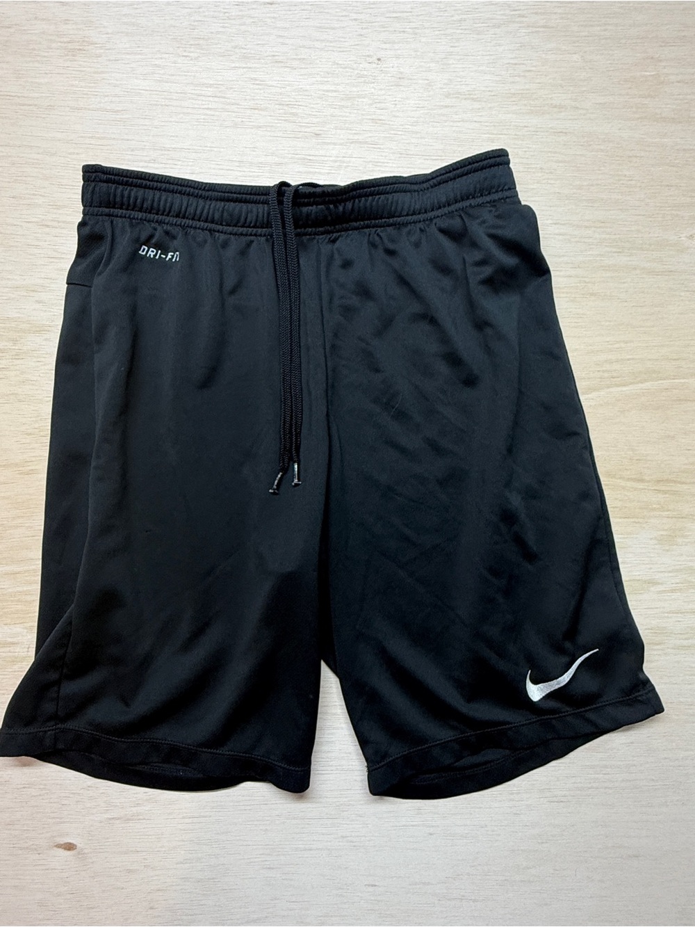 Nike Dri-Fit athletic training shorts in solid black.
